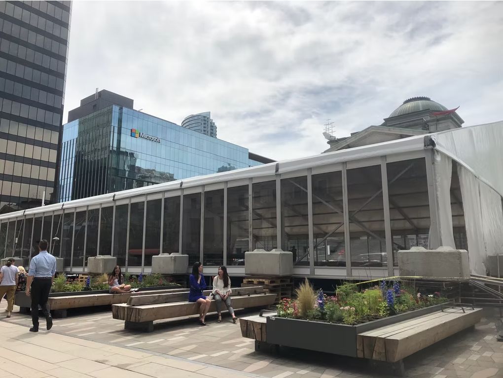 Structure tent with glass walls on a downtown Vancouver rooftop
